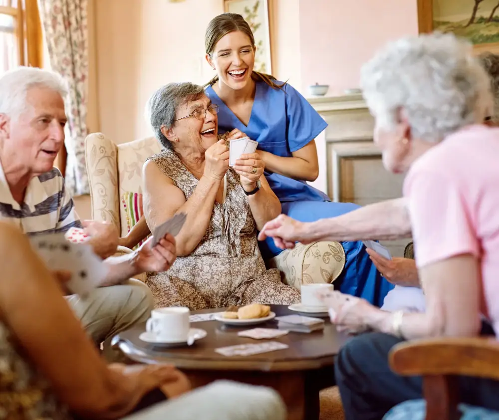 The suspense keeps the game exciting. Shot of a group of happy seniors playing a card game in their retirement home while a nurse watches (1) The suspense keeps the game exciting. Shot of a group of happy seniors playing a card game in their retirement home while a nurse watches